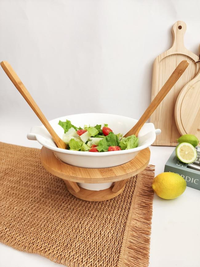 Elegant salad bowl set featuring a deep white ceramic bowl with wood base