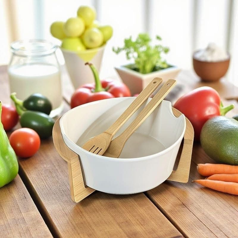 Salad bowl set featuring a deep white ceramic bowl with side handles